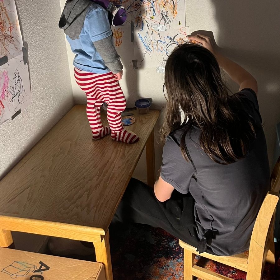 Toddler climbing furniture.