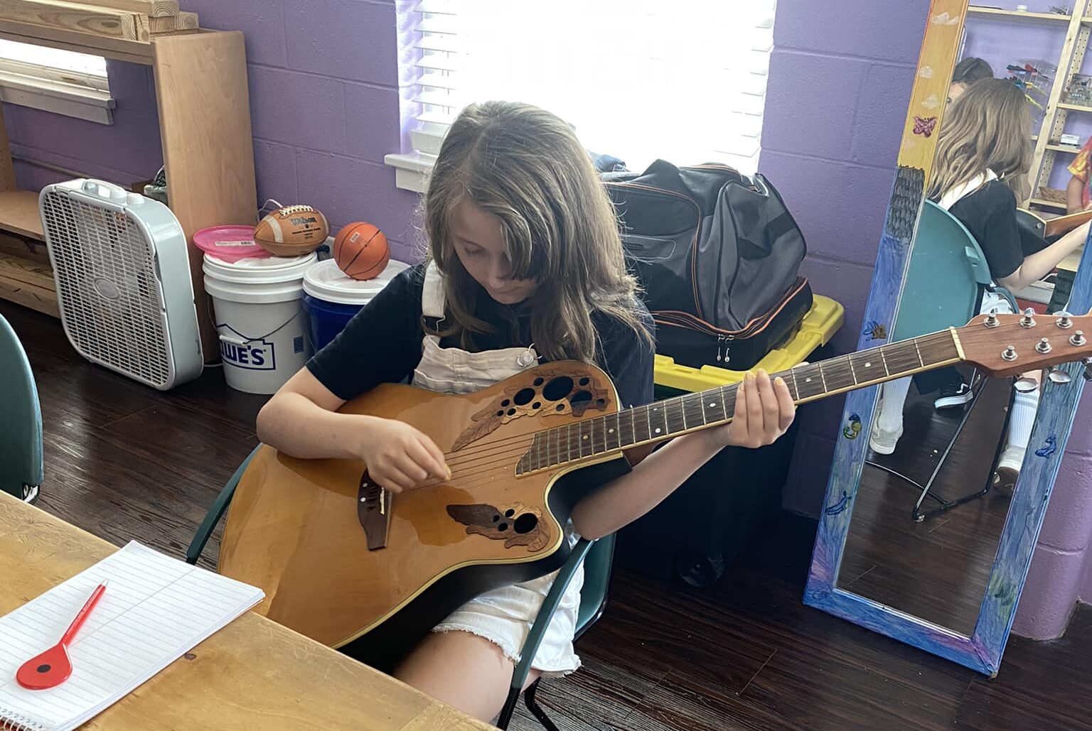 Playing guitar at Clearview, A. Walters