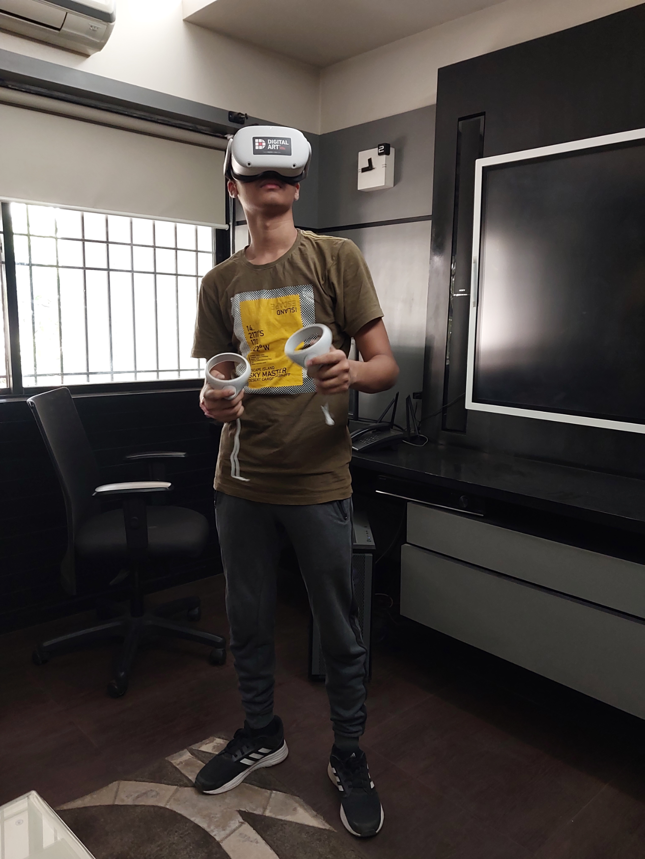 Photo of author in a room with a virtual reality headset on